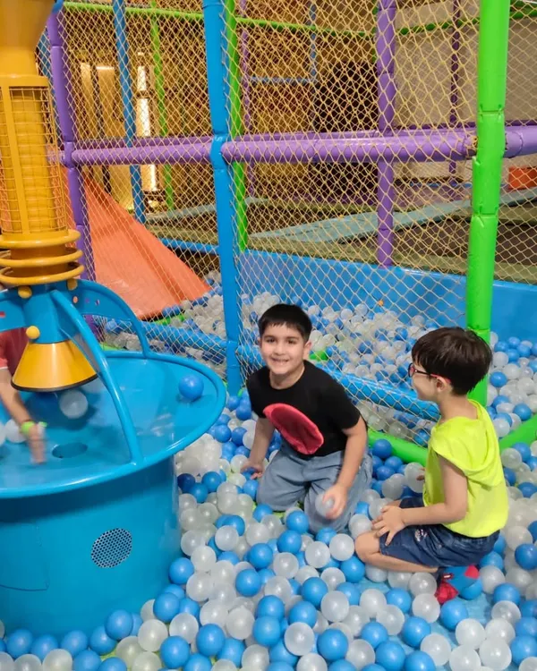Our massive ball pit is a favorite among kids, complete with a ball fountain that creates a shower of colorful balls.