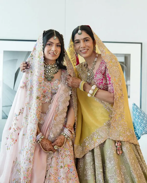 A beautiful moment between a bride and her mother, both ready for the Pheras. I created complementary looks that highlight their individual beauty, focusing on radiant skin for the mother and a soft, traditional look for the bride.