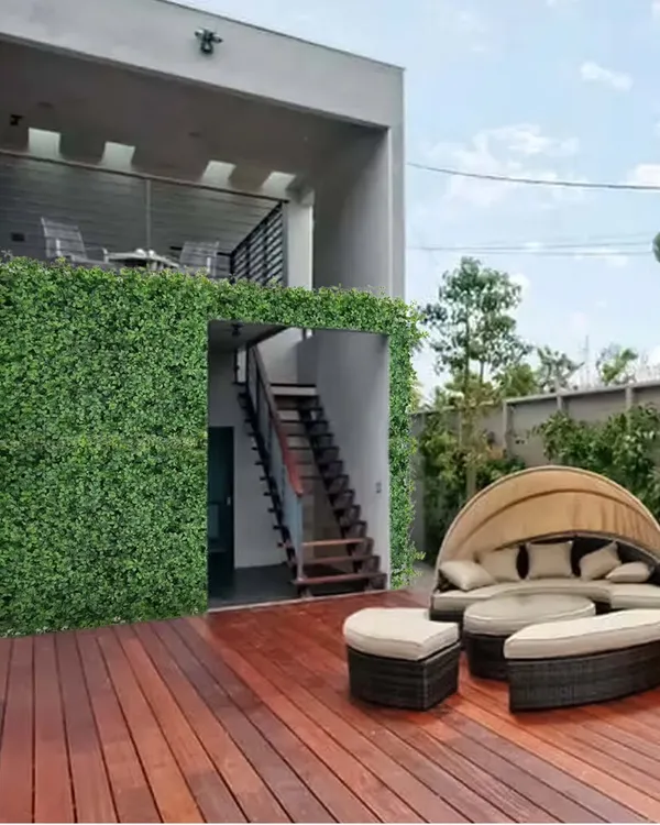 Imagine relaxing here. I turned this outdoor terrace into a private green oasis by covering the walls with a lush, maintenance free artificial garden, creating the perfect spot to unwind.
