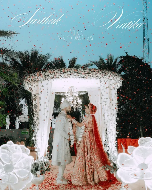The pinnacle of the ceremony, the Varmala exchange. We capture this moment with a sense of grandeur, complete with a shower of petals and the beautiful floral mandap at Sarthak and Vratika's wedding.