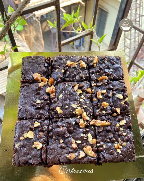 My classic Chocochip Walnut Brownies are a customer favorite. They are fudgy, loaded with chocolate chips and crunchy walnuts, and perfect for any occasion.