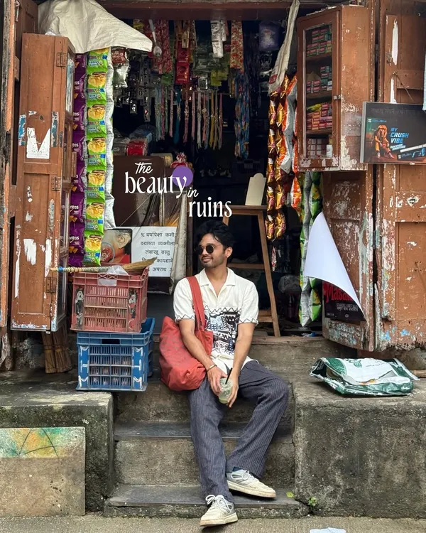 The beauty in ruins. A self-portrait sitting on the steps of a rustic old shop, finding a moment of peace in the chaos.