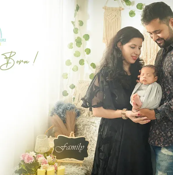 "A Star is Born." A beautiful moment as new parents gaze lovingly at their newborn. We create these light-filled, airy portraits that feel both classic and modern.
