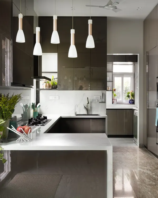 This is where style meets function. I designed this modern kitchen to be the heart of the home, with sleek, high-gloss cabinetry, a durable quartz countertop, and an open layout that is perfect for both everyday cooking and entertaining guests. The pendant lights add a touch of warmth and sophistication.