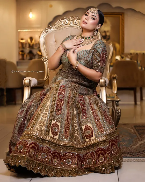 A regal bridal look featuring intricate jewellery and a rich, detailed lehenga. My makeup artistry focused on creating a radiant complexion and defined features to complement the grandeur of the entire ensemble.