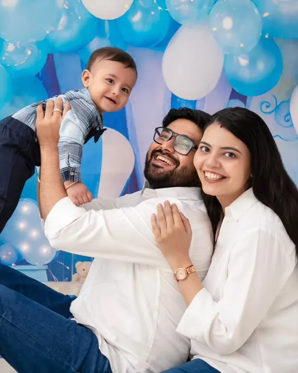 A moment of pure family fun. The father lifts his son, and everyone is sharing a genuine laugh. This is the kind of joyful, chaotic moment we love to capture.