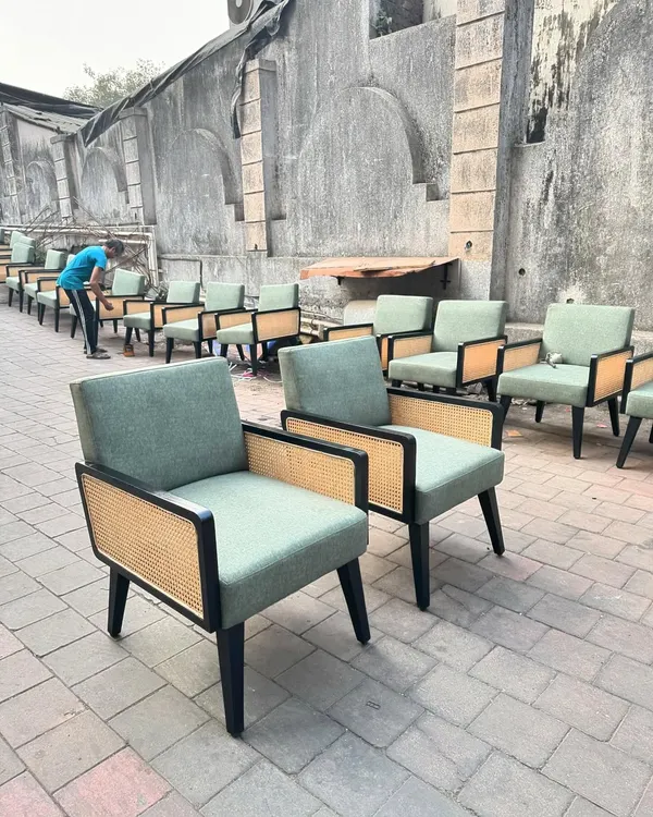 A large order of my boxy lounge chairs with black frames and cane panels, ready for a hotel lobby or cafe. I can produce furniture in large quantities for commercial projects, ensuring consistency and quality across every piece.