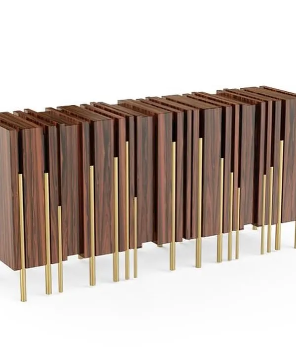 Inspired by the stunning gothic architecture of London, our "Glory" sideboard reflects verticality and rhythm. The piece features a series of wood-veneered panels of varying depths, supported by delicate polished brass legs.