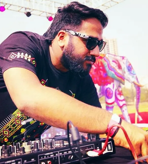 A candid shot of me DJing at a daytime event. Whether it's day or night, indoor or outdoor, the goal is always the same: make people dance.