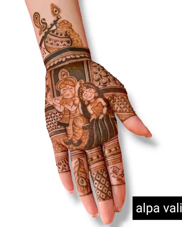 A beautiful design for Janmashtami, featuring Radha and Krishna on the palm with a 'matki' and flute on the wrist.