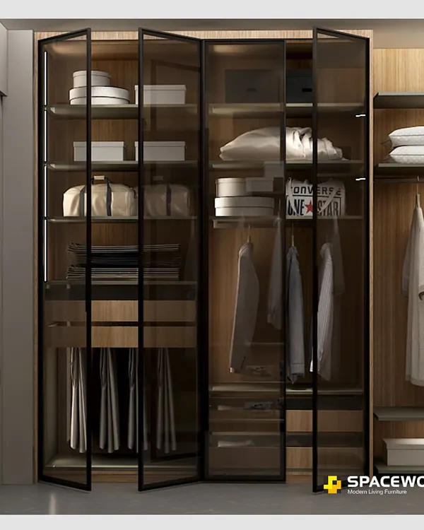 This walk-in wardrobe combines warm wood interiors with sleek, black-framed tinted glass doors. The integrated LED lighting illuminates your collection, making it easy to find exactly what you need while creating a sophisticated, boutique-like feel in your own home.