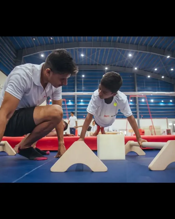 You truly do not become a 'coach' until you have coached younger athletes. Here, I'm working with a young gymnast, focusing on building foundational strength and instilling a professional mindset.