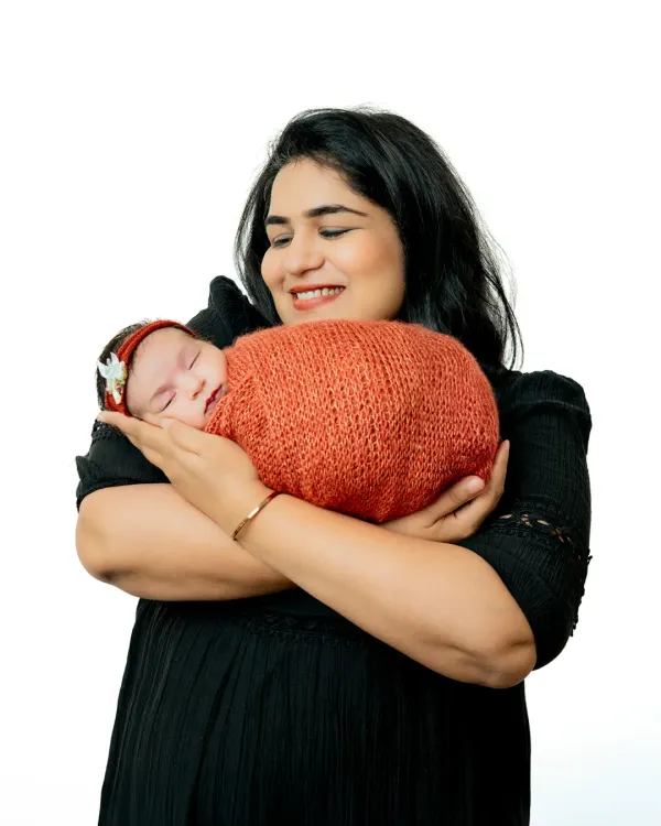 The warmth of a mother's embrace is a memory to cherish. I aim to capture that pure love and happiness in simple, beautiful portraits.