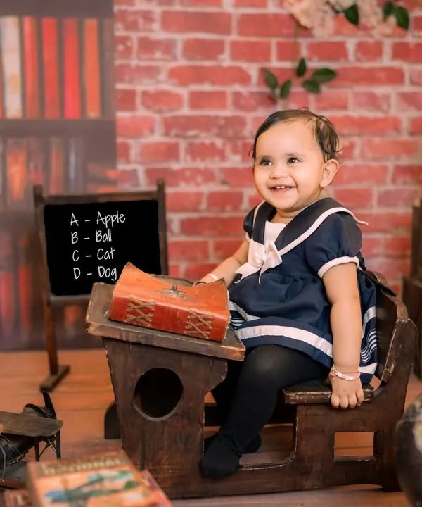 Back to school in the cutest way possible. Our rustic schoolhouse set features a miniature wooden desk, a chalkboard, and a globe, creating an adorable and scholarly scene for your little one.