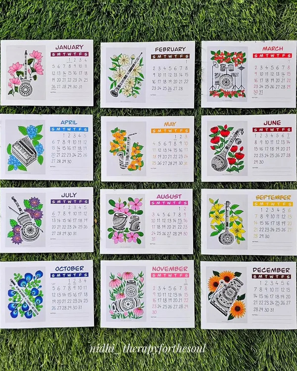 Here are all twelve months of the 2025 calendar laid out. You can see the full collection of floral and musical instrument pairings, from the January Lotus & Guitar to the December Sunflower & Xylophone.