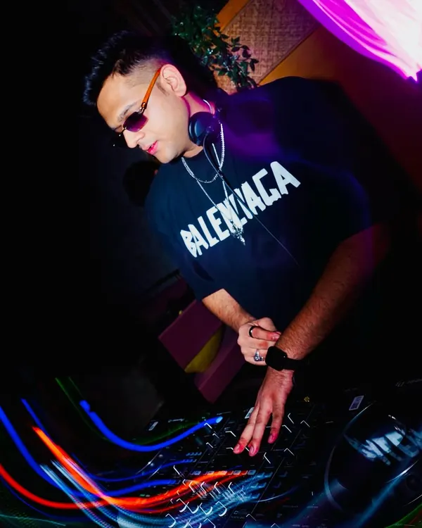 Lost in the music, focused on the mix. This shot captures me in the zone, blending tracks and controlling the bassline to create a seamless journey.