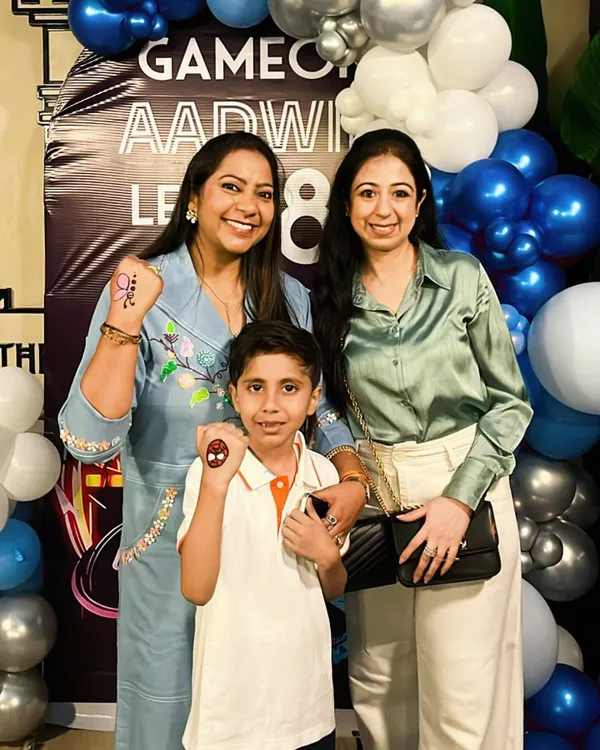 The birthday boy and his family showing off their fun glitter tattoos. I can add extra activities like tattoos and games to make the celebration even more special.