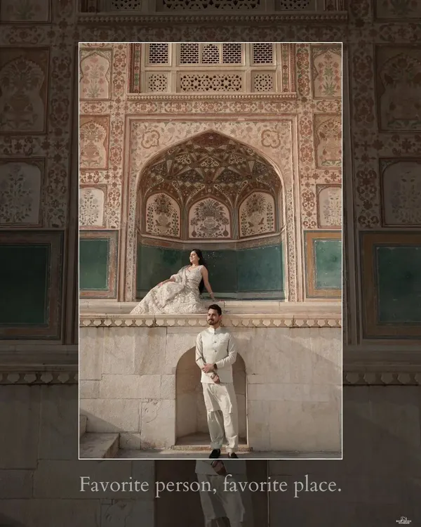 A majestic shot at Amer Fort in Jaipur, where the couple is framed by the intricate, historic architecture, showcasing the grandeur of a royal-themed pre-wedding shoot.