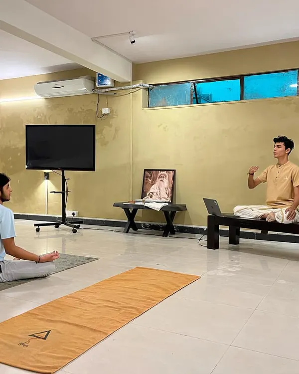 Guiding a participant through the subtleties of Surya Kriya. Each workshop focuses on providing precise, individual instruction to ensure the practice is learned correctly and safely.