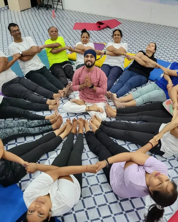 A beautiful moment from our Yoga Day event. The whole class formed a human circle, connecting hands and feet, with me at the center. This represents the unity and harmony we cultivate in our practice.