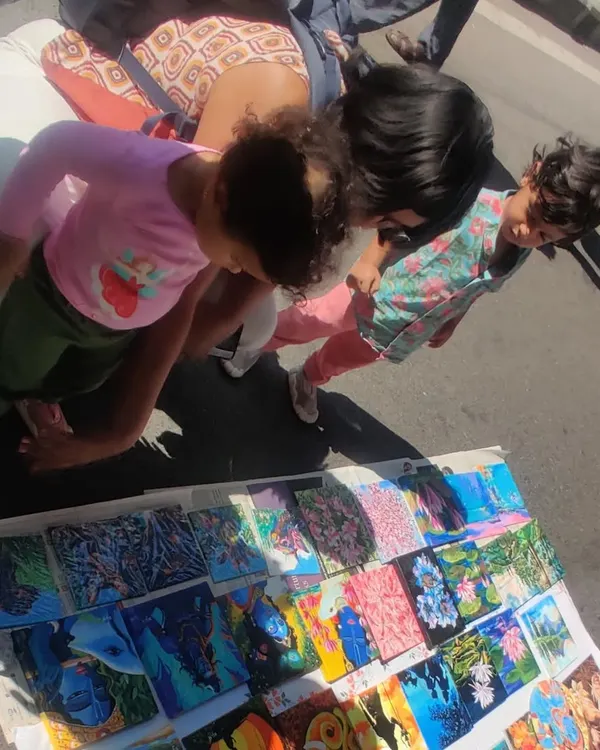 My collection of tiny paintings spread out at Chitra Santhe, attracting art admirers of all ages. These small canvases are a great way to start your art collection.