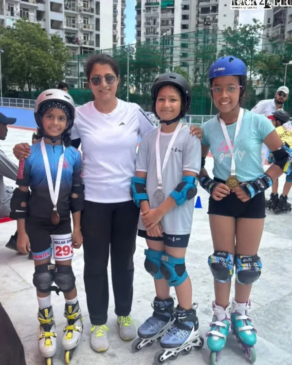 A proud coach with our decorated skaters after their success at the 2025 Interschool Skating Competition. Each medal represents countless hours of practice and perseverance.