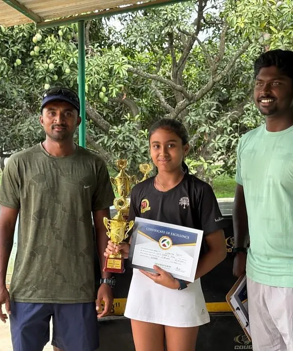 Linesha Shetty celebrating her Singles Title win at the CS7 U/12 in Bengaluru, pictured with her coaches.