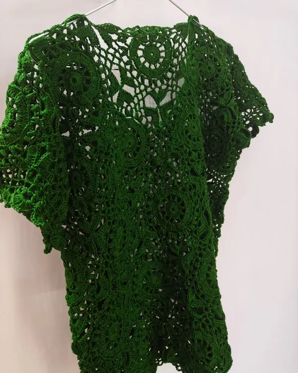 This is my signature green lace top, a piece that holds so much of my heart. It's crafted from over 45 individual hexagon motifs using pure, breathable cotton yarn. Each motif takes time and focus, but seeing them come together into this intricate, wearable piece of art makes all the effort worthwhile.
