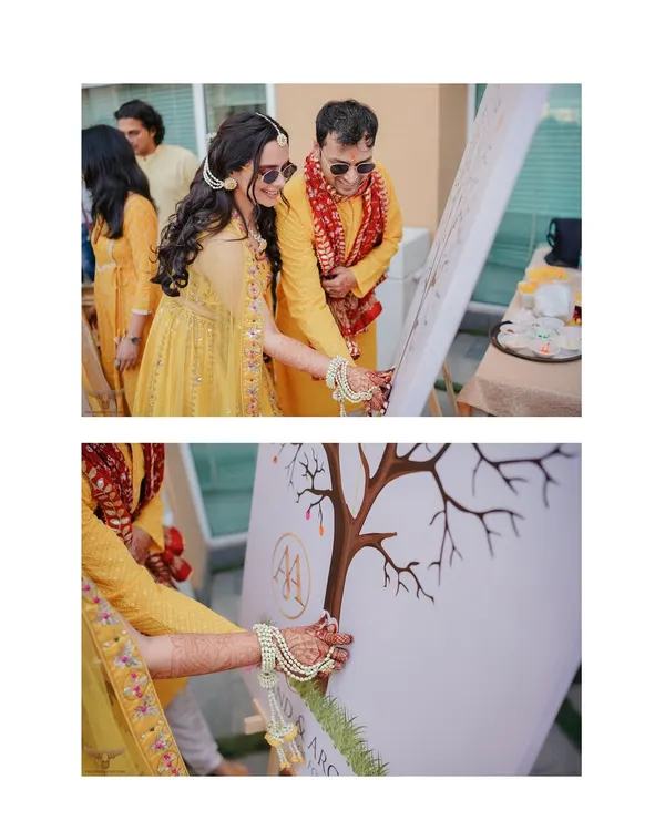 A unique and personal touch at the Haldi ceremony. The couple and their family add their thumbprints to a "family tree" painting, a beautiful symbol of two families becoming one.