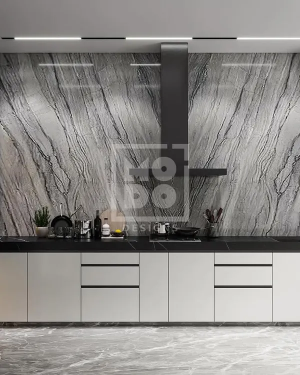 Cooking up a storm in style. This modern kitchen features a stunning marble backsplash, sleek white cabinetry, and a professional-grade chimney, blending high functionality with luxurious aesthetics.