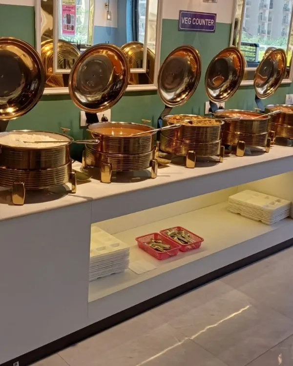 A close-up of my buffet counter. I use these traditional brass serving dishes, called 'chafing dishes', to keep the food warm and fresh for all my guests.