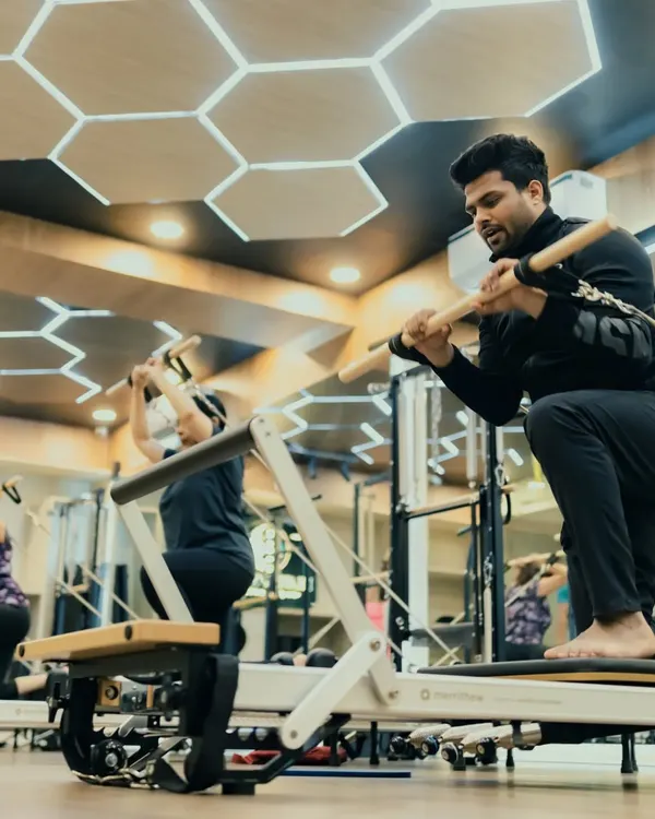 This client performs a deep stretch using the Reformer, working on flexibility and control. Regular stretching is key to keeping the body limber and injury-free.