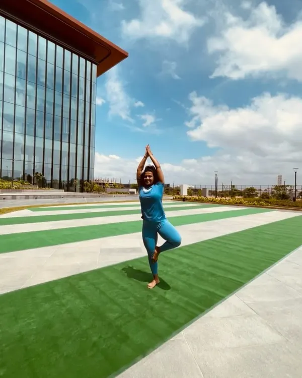 Practicing Vrikshasana (Tree Pose) on Yoga Day. Movement is my medicine, and I believe in incorporating different disciplines like yoga for balance and flexibility.