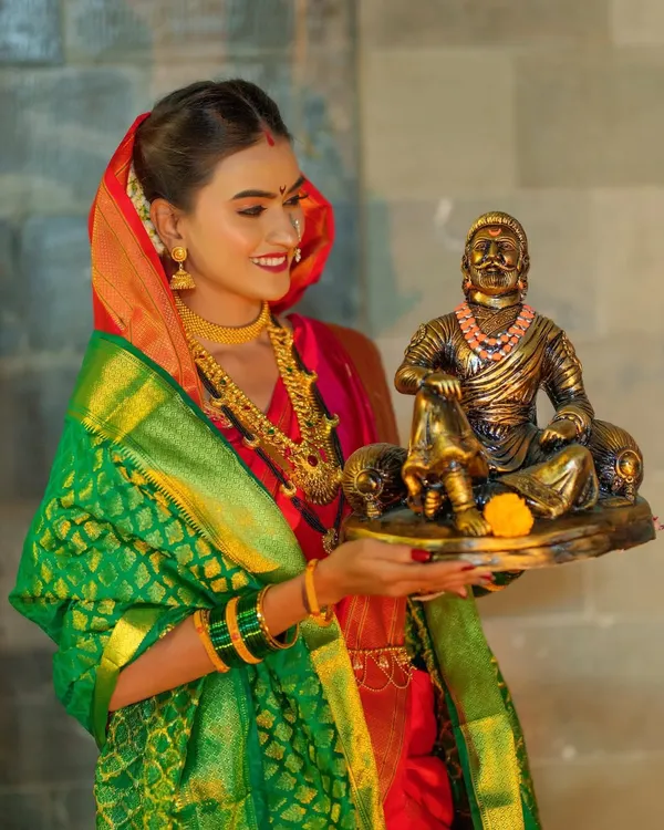 A powerful image from my 'Shivkanya' series, celebrating the legacy of Chhatrapati Shivaji Maharaj. The model is styled as a warrior princess, holding a statue of the great king.