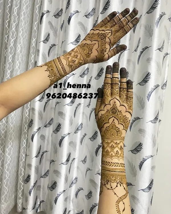 A beautiful semi-bridal or party design that covers the back of the hand and wrist with architectural and floral elements.