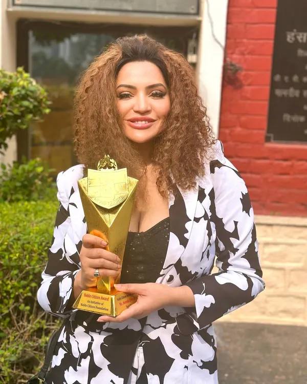 Holding the Noble Icon Award. I truly believe that when you work hard, you grow. This award is a testament to my journey and my commitment to this profession.