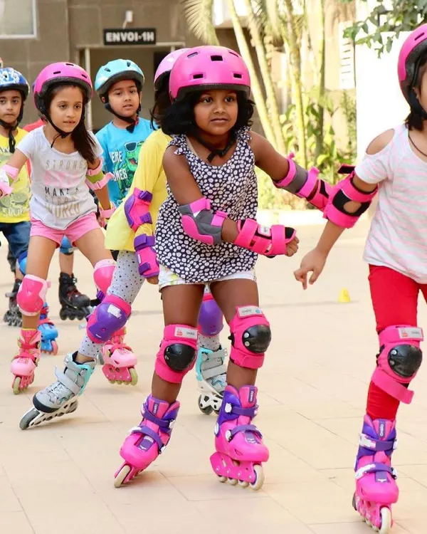 Our beginner group learning to move together in a line. I teach kids in a fun way, ensuring they are always wearing full protective gear, including helmets and pads.