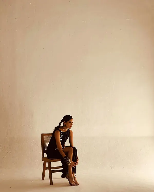 A minimalist fashion shot with a focus on silhouette and attitude. I styled this simple black dress with bold, stacked bracelets and a sleek hairstyle, using negative space in the composition to create a modern and edgy portrait.