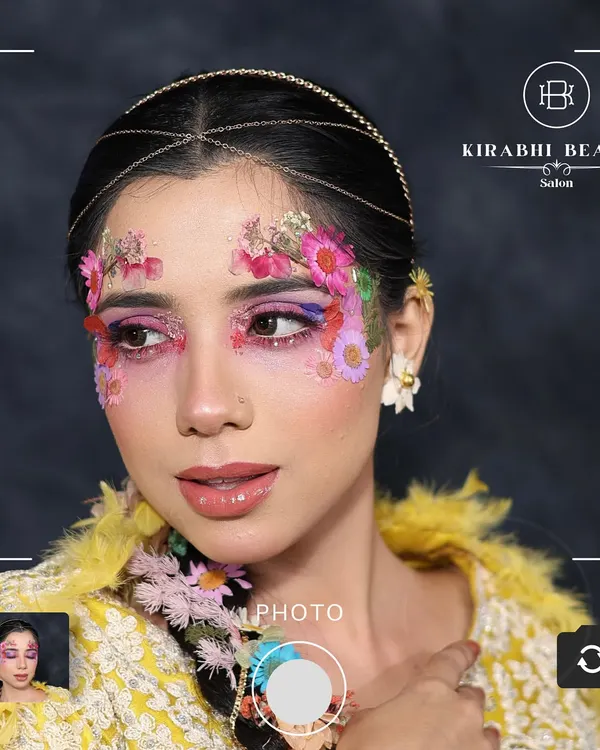 This artistic floral makeup is one of my favorite creative looks. I used real dried flowers and a blend of pink and purple pigments to create a fantasy-inspired look.