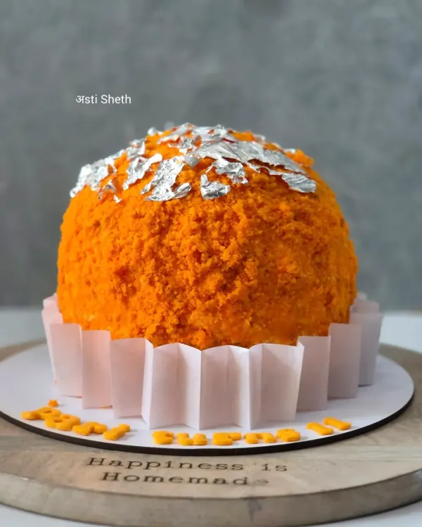 A unique Motichoor Ladoo-inspired cake, topped with edible silver varq. This is a creative fusion where I blend traditional Indian sweet flavours with modern cake design.