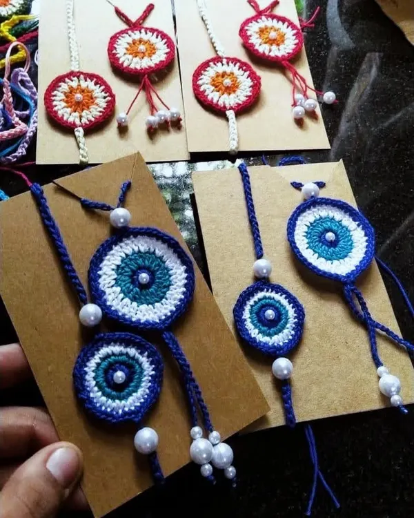Our evil eye rakhi and lumba sets are a modern take on a beautiful tradition. Each set is handmade and includes pearl details for an elegant finish.