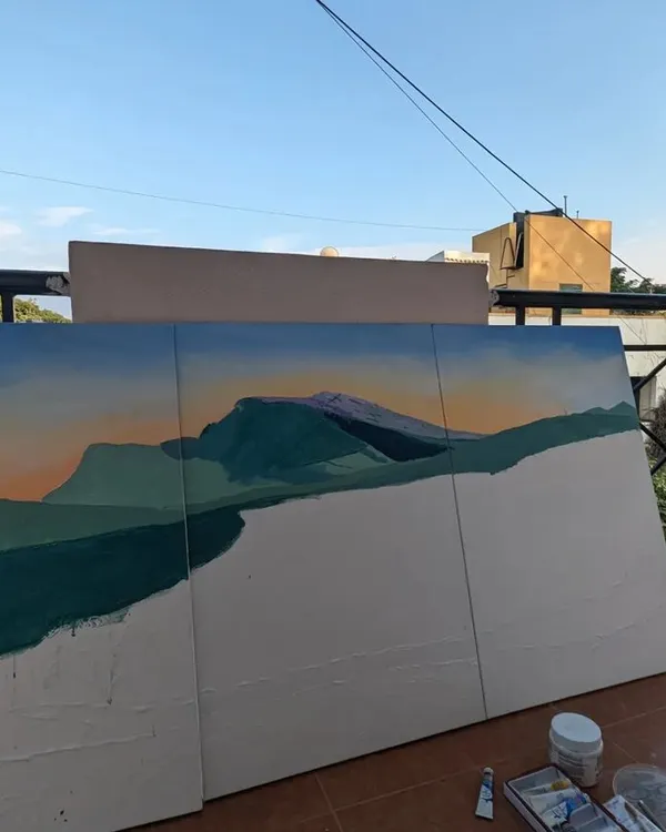 The beginning stages of the Neelakurinji landscape triptych. I often start my work outdoors to connect with the natural light, laying down the foundational colors and shapes of the mountains and sky.