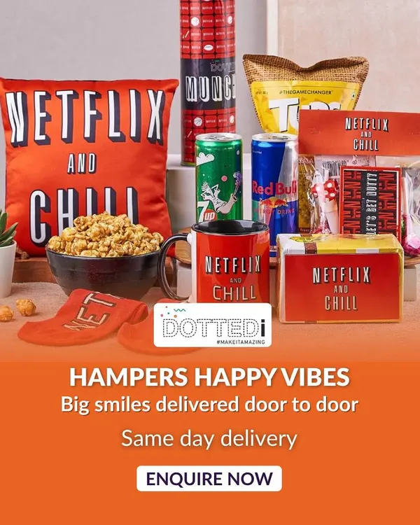 Here is my signature "Netflix and Chill" hamper, a bestseller for a reason. It's packed with gourmet popcorn, energy drinks, a comfy cushion, and other fun snacks, creating the ultimate binge-watching experience right out of the box.