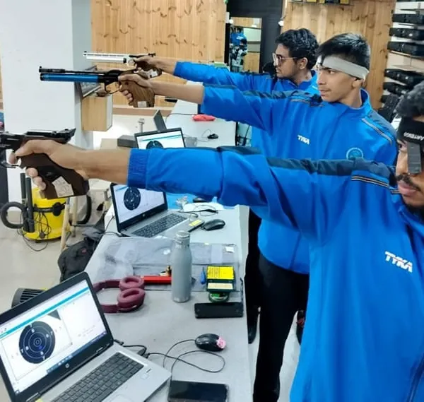 Here, our pistol shooters are deep in focus, using our advanced SCATT training systems. The laptops provide instant feedback on every shot, a key part of our Olympic-standard training methodology for 10m air pistol.
