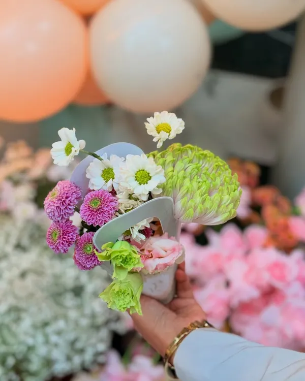 A beautiful hand-held posy of fresh flowers, showcasing the delicate floral work that I incorporate into my events.