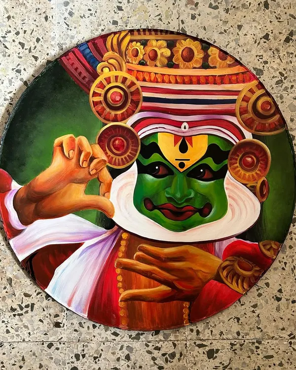 A hand-painted circular canvas depicting a Kathakali dancer, capturing the 'Adbhutam' (wonder) expression. This piece is part of a series celebrating the nine 'Navarasas' or emotions of classical Indian dance.