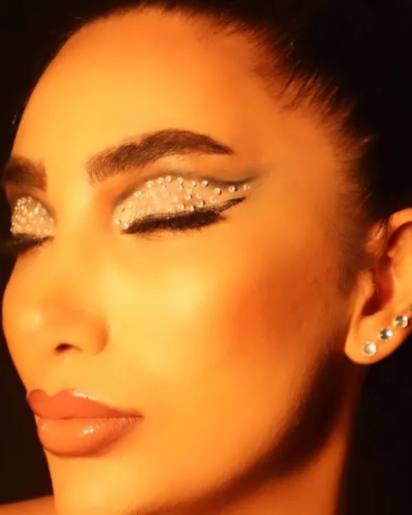 This rhinestone eye makeup is pure creativity. I love experimenting with different textures and materials to create unique, conceptual looks like this one.