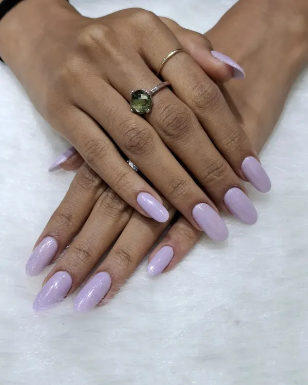 Soft and chic in lavender. This is a beautiful, simple gel manicure in a lovely pastel purple shade, perfect for a clean and polished everyday look.
