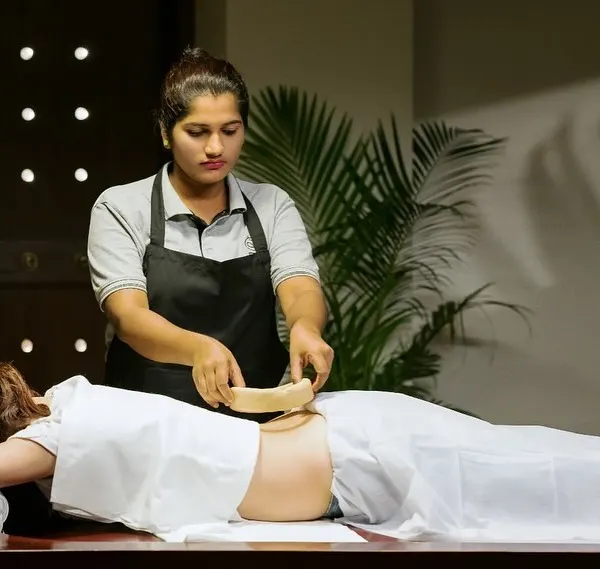 Here is a closer look at Kati Basti, a cornerstone of our back pain treatment. The warm, medicated oil penetrates deep into the tissue, relieving muscle spasms, nourishing the spinal nerves, and improving flexibility.