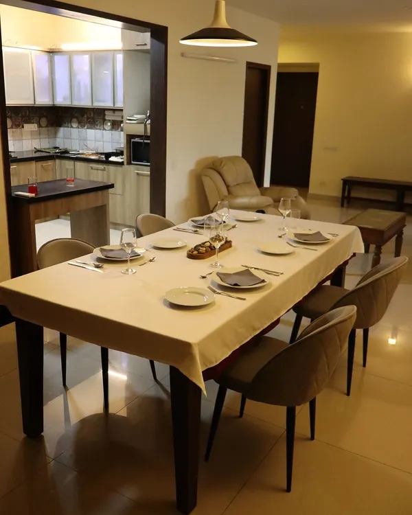 The table is set for an evening of culinary discovery. I believe the ambiance is just as important as the food, creating a warm and elegant setting for my guests.